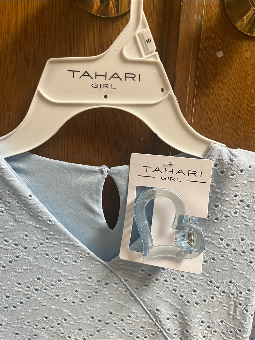 Tahari Kids Pale Blue Eyelet Wrap Dress with Ruffle Skirt and a hair clip